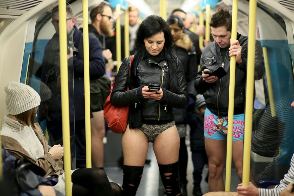 Brunette woman rides a train in her underwear